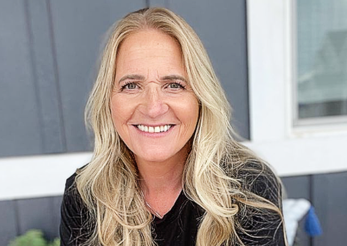 Smiling woman with long blonde hair and black top. Smiling woman with long blonde hair and black top.