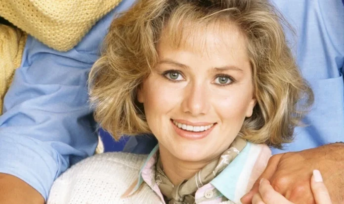 A smiling woman with blonde hair and light makeup. A smiling woman with blonde hair and light makeup.