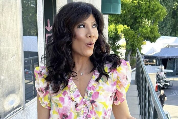 Woman in floral dress posing outdoors with playful expression. Woman in floral dress posing outdoors with playful expression.