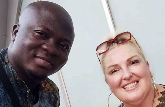 A smiling man and woman posing for a close-up selfie indoors. A smiling man and woman posing for a close-up selfie indoors.