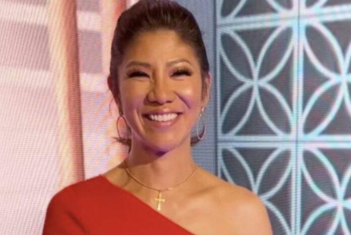 Smiling woman in a red dress with elegant earrings. Smiling woman in a red dress with elegant earrings.