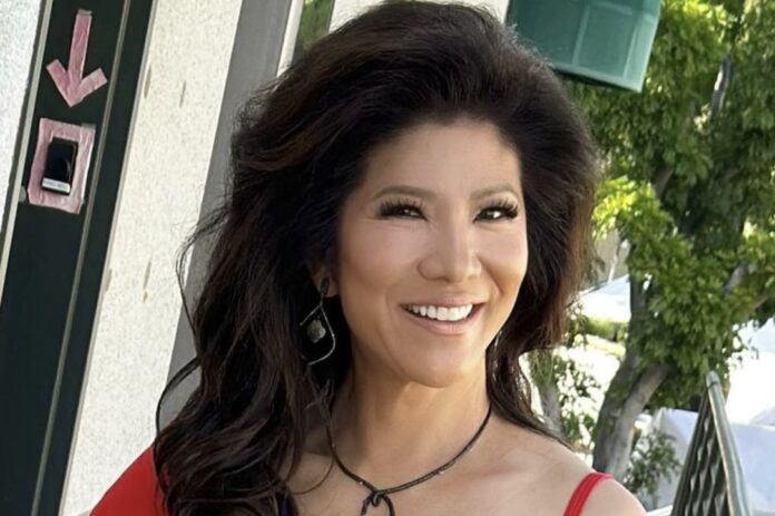 Smiling woman with long dark hair in a red top outdoors. Smiling woman with long dark hair in a red top outdoors.