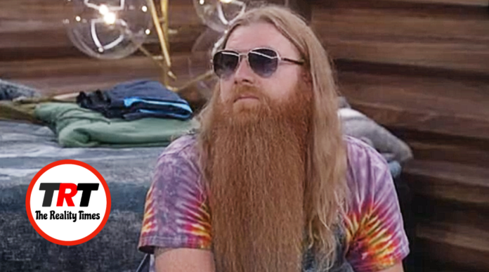 Man with long red beard wearing sunglasses and a tie-dye shirt. Man with long red beard wearing sunglasses and a tie-dye shirt.