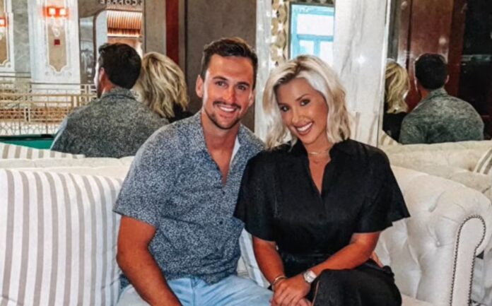 A smiling couple sitting closely together indoors. A smiling couple sitting closely together indoors.