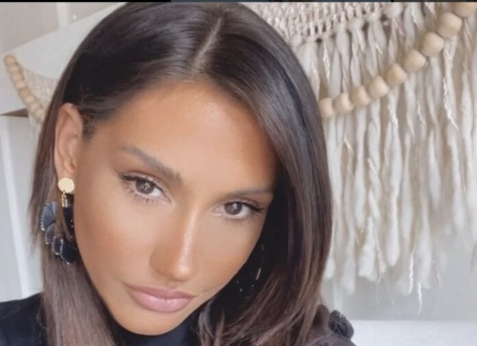 Close-up of a woman with sleek dark hair and subtle makeup. Close-up of a woman with sleek dark hair and subtle makeup.
