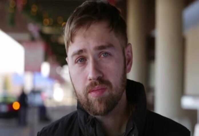 A young man with light brown hair and a beard looks thoughtfully at the camera. A young man with light brown hair and a beard looks thoughtfully at the camera.