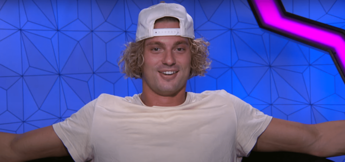 Young man with curly blond hair wearing a white cap and shirt. Young man with curly blond hair wearing a white cap and shirt.