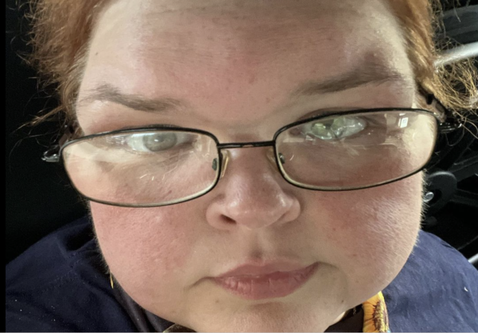 Close-up of a person wearing glasses, looking directly at the camera. Close-up of a person wearing glasses, looking directly at the camera.