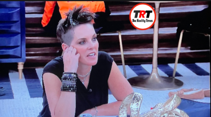 Woman with spiked hair and multiple bracelets in a casual setting. Woman with spiked hair and multiple bracelets in a casual setting.