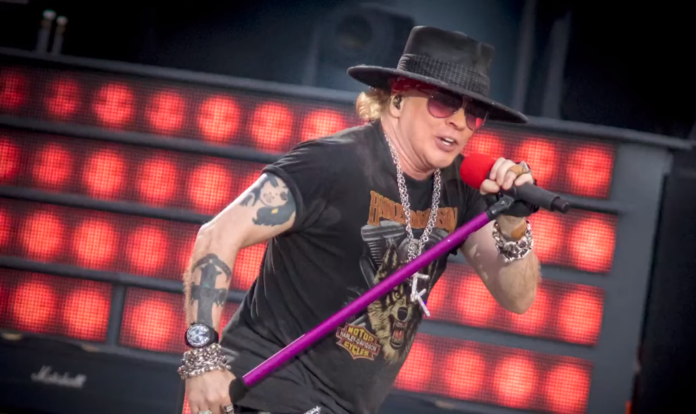 Rock singer passionately performing on stage with a microphone. Rock singer passionately performing on stage with a microphone.