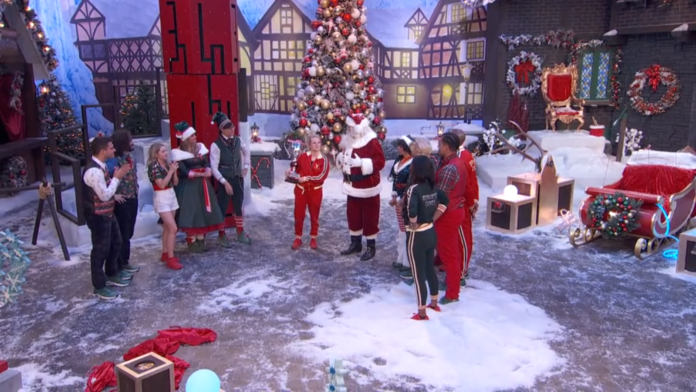 Santa Claus and elves preparing for Christmas in a festive village setting. Santa Claus and elves preparing for Christmas in a festive village setting.