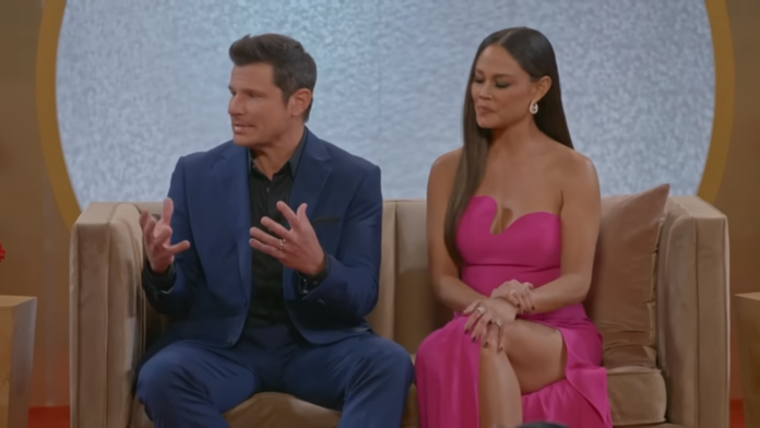 Two people seated, engaged in a conversation. Two people seated, engaged in a conversation.