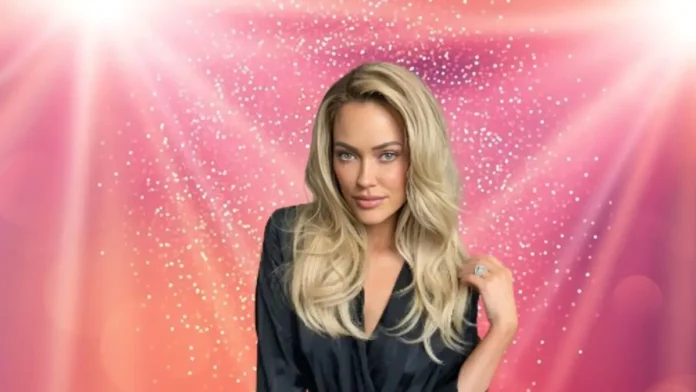 Blonde woman in a black blouse posing against a pink glittery background. Blonde woman in a black blouse posing against a pink glittery background.