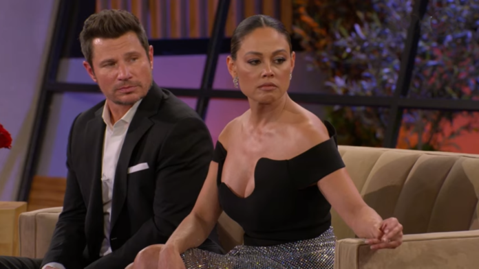 Two people sitting together on a set, engaged in conversation. Two people sitting together on a set, engaged in conversation.