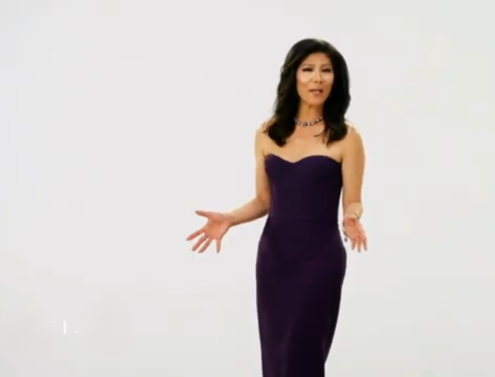 Woman in a strapless purple dress gesturing with hands. Woman in a strapless purple dress gesturing with hands.