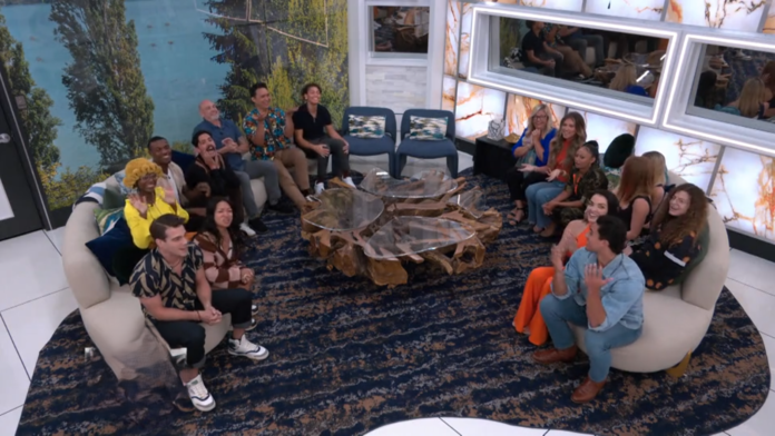 A group of people seated in a living room with a unique wooden coffee table. A group of people seated in a living room with a unique wooden coffee table.