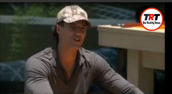 Man wearing a camouflage cap and dark shirt outdoors. Man wearing a camouflage cap and dark shirt outdoors.