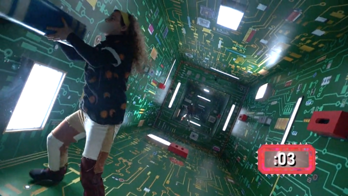 Person inside a room with circuit board-themed walls and ceiling. Person inside a room with circuit board-themed walls and ceiling.