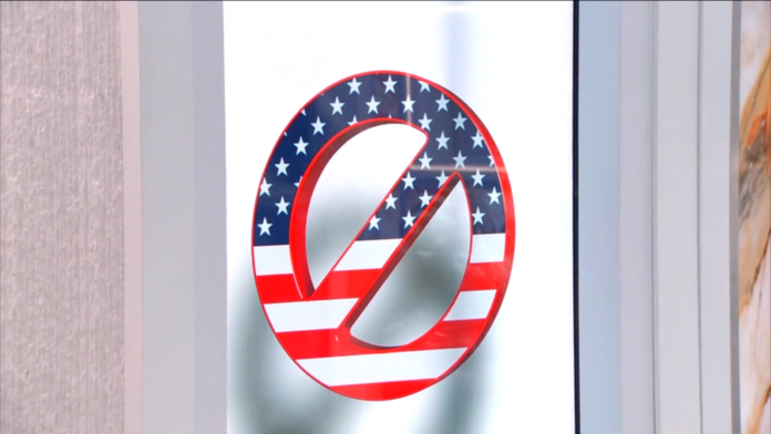 No smoking sign with American flag design on glass. No smoking sign with American flag design on glass.