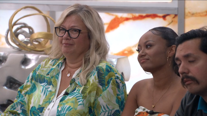 Two women sitting together, one wearing glasses and a floral shirt. Two women sitting together, one wearing glasses and a floral shirt.