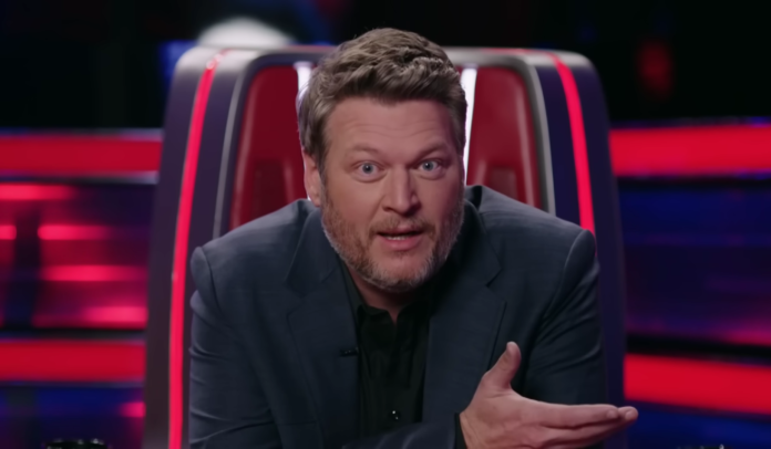 A man speaking passionately on a TV show. A man speaking passionately on a TV show.