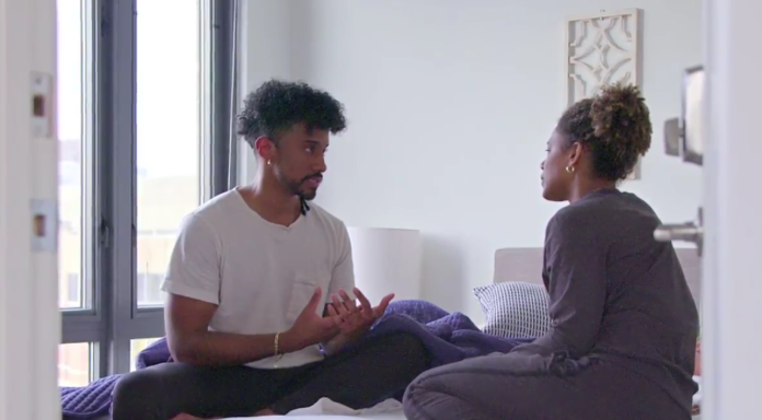 Two people engaged in a serious conversation indoors. Two people engaged in a serious conversation indoors.