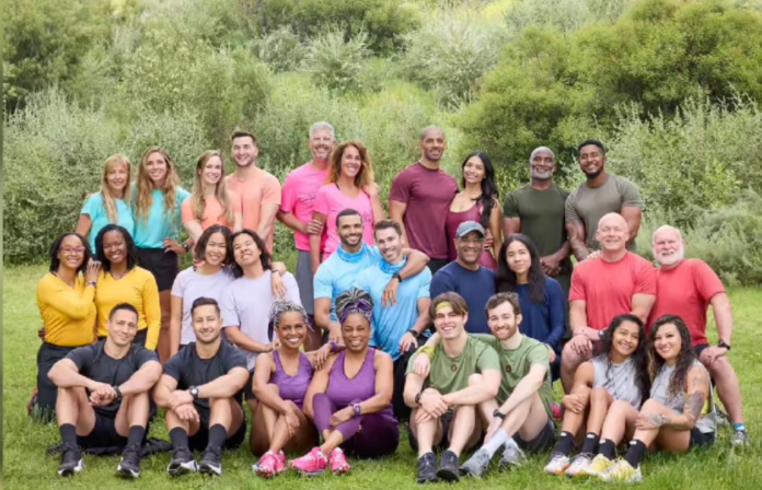 Diverse group of people posing outdoors on grass with trees behind. Diverse group of people posing outdoors on grass with trees behind.