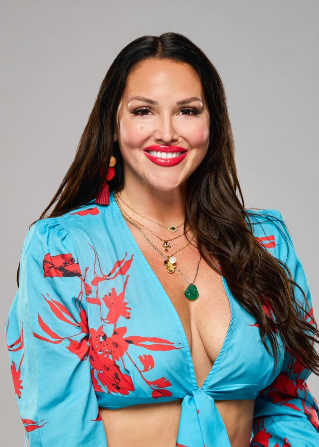 A beach at sunset with vibrant colors and calm waves.