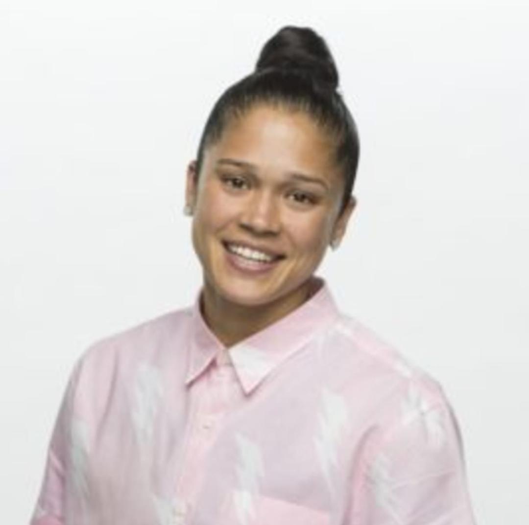 A beach at sunset with vibrant colors and calm waves.