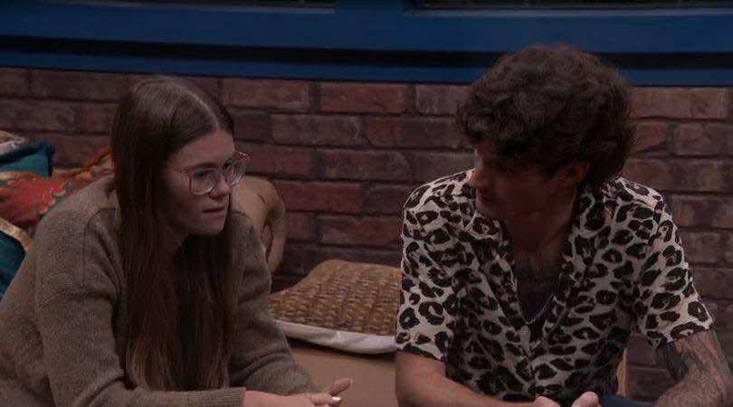 A beach at sunset with vibrant colors and calm waves.