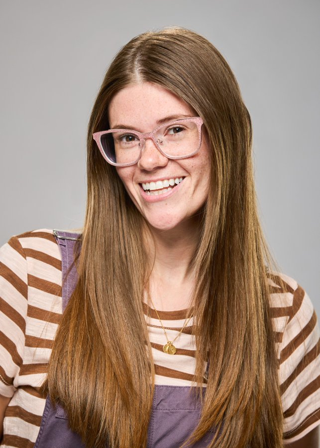 A beach at sunset with vibrant colors and calm waves.
