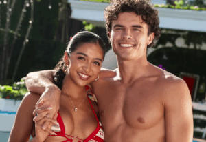 A beach at sunset with vibrant colors and calm waves.