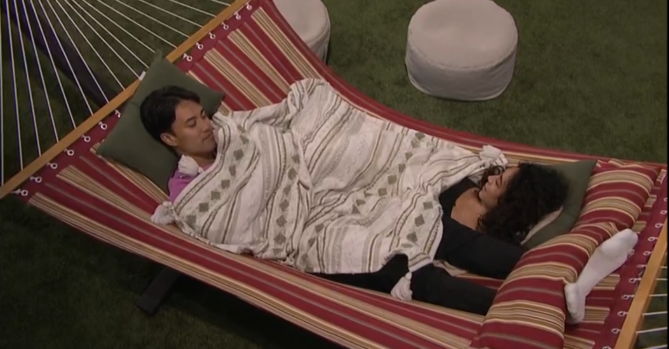 A beach at sunset with vibrant colors and calm waves.