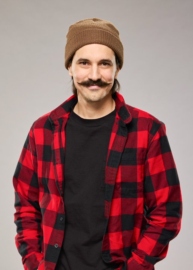 A beach at sunset with vibrant colors and calm waves.