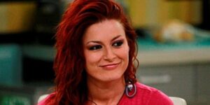 A beach at sunset with vibrant colors and calm waves.