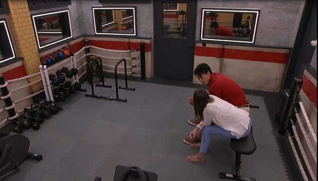 A beach at sunset with vibrant colors and calm waves.