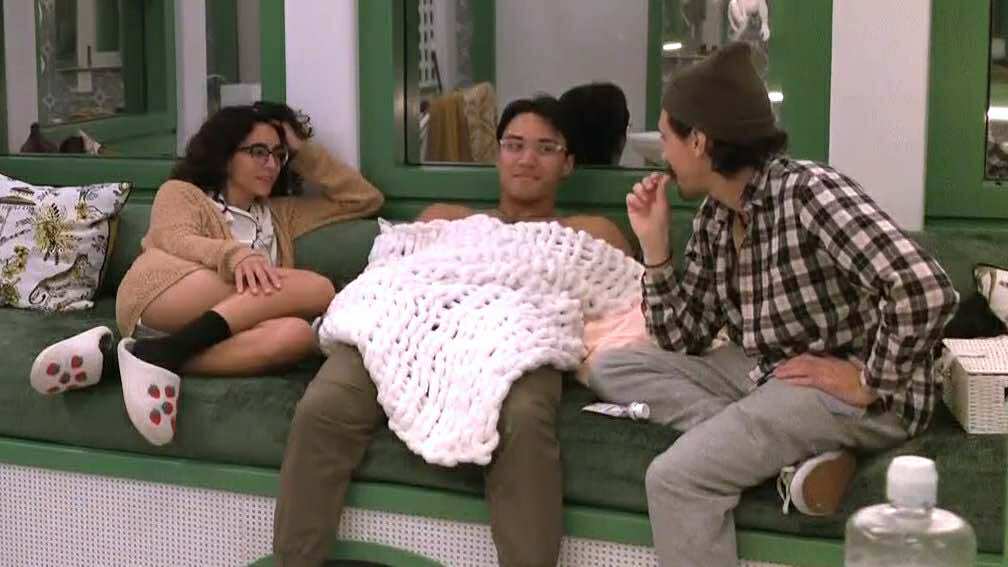 A beach at sunset with vibrant colors and calm waves.