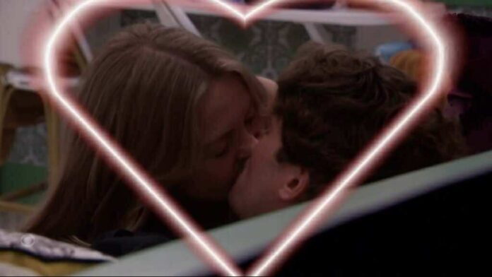 Two people sharing a kiss framed by glowing heart shapes. Two people sharing a kiss framed by glowing heart shapes.