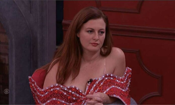 A woman with red hair wearing a red and white off-shoulder top. A woman with red hair wearing a red and white off-shoulder top.