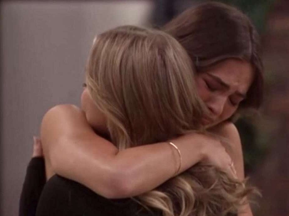A beach at sunset with vibrant colors and calm waves.