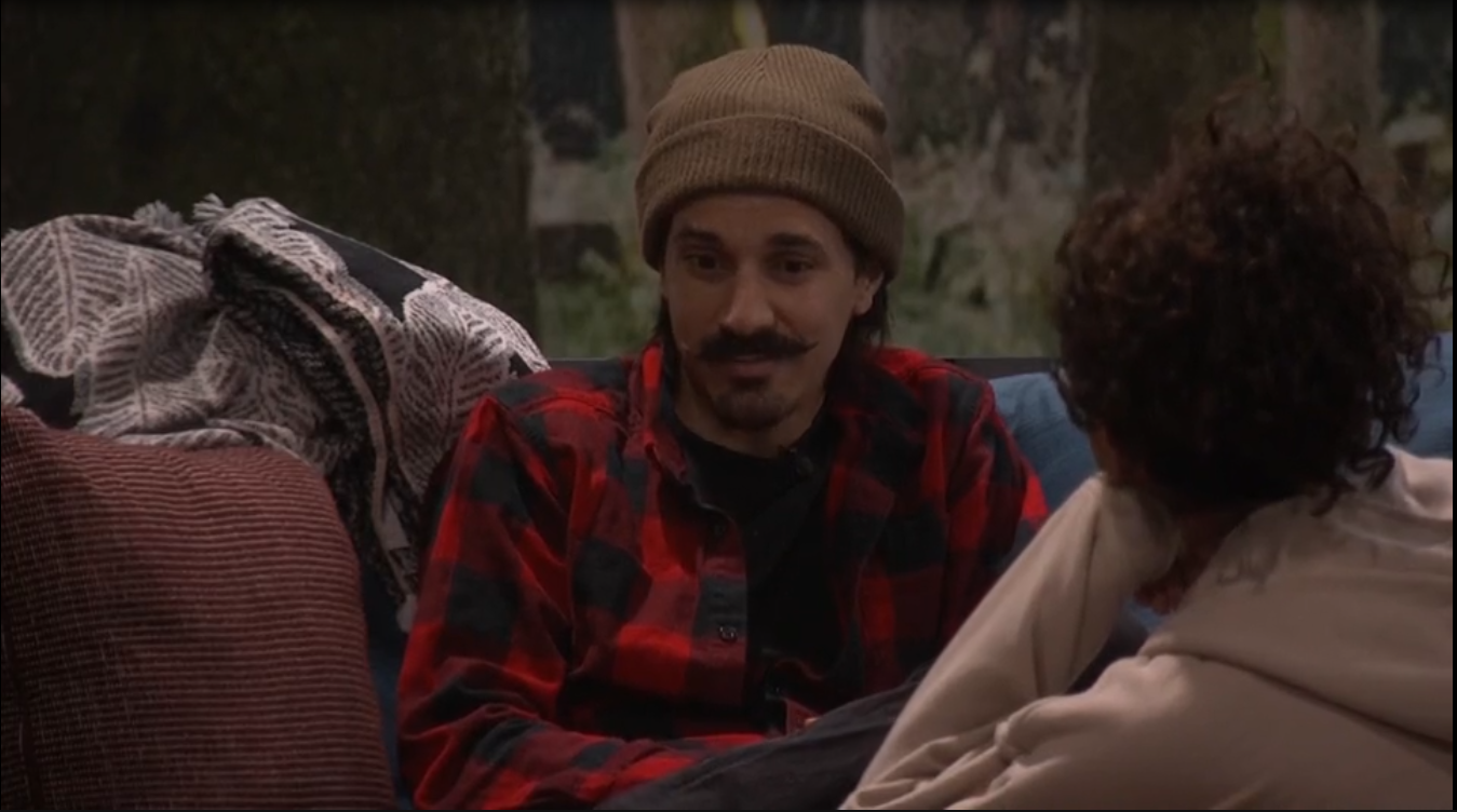 A beach at sunset with vibrant colors and calm waves.