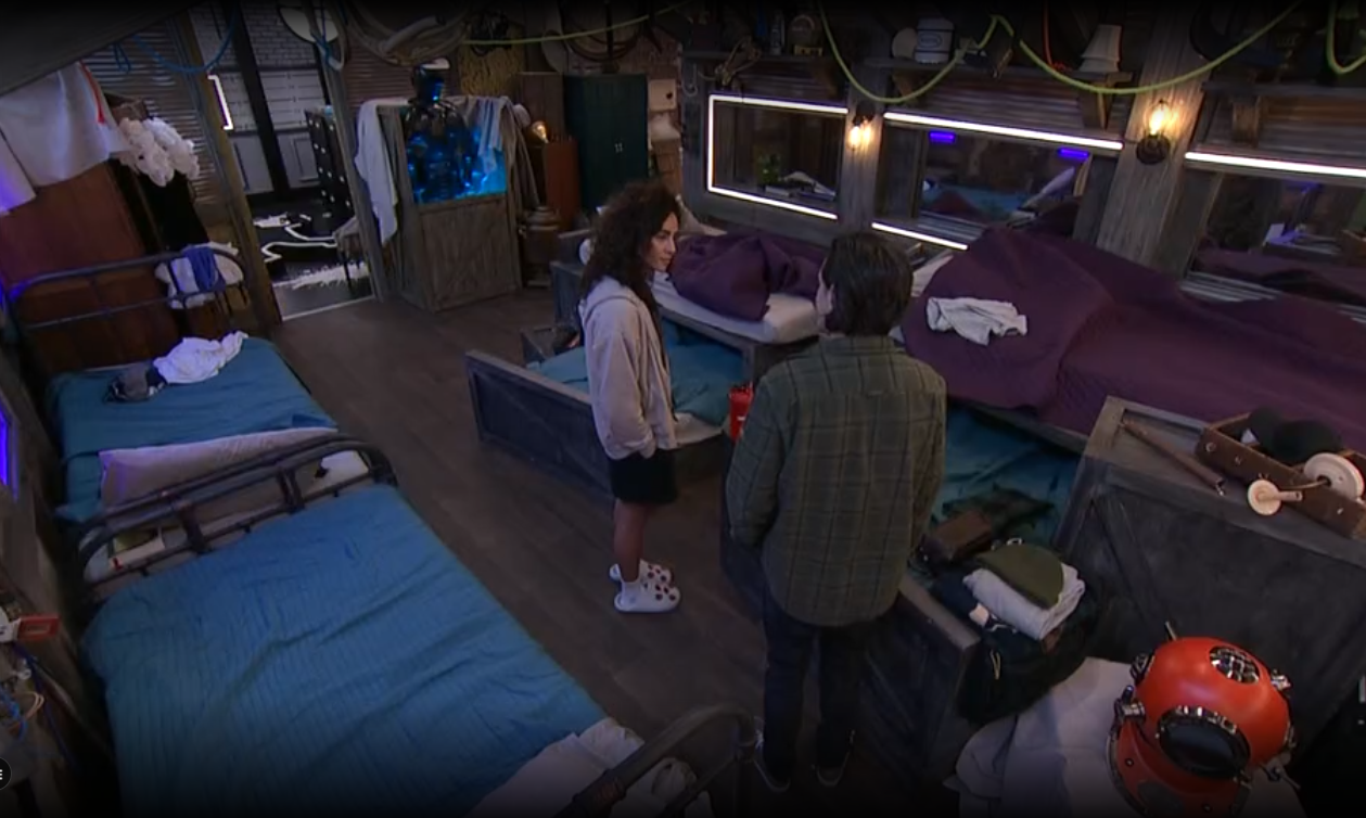 A beach at sunset with vibrant colors and calm waves.