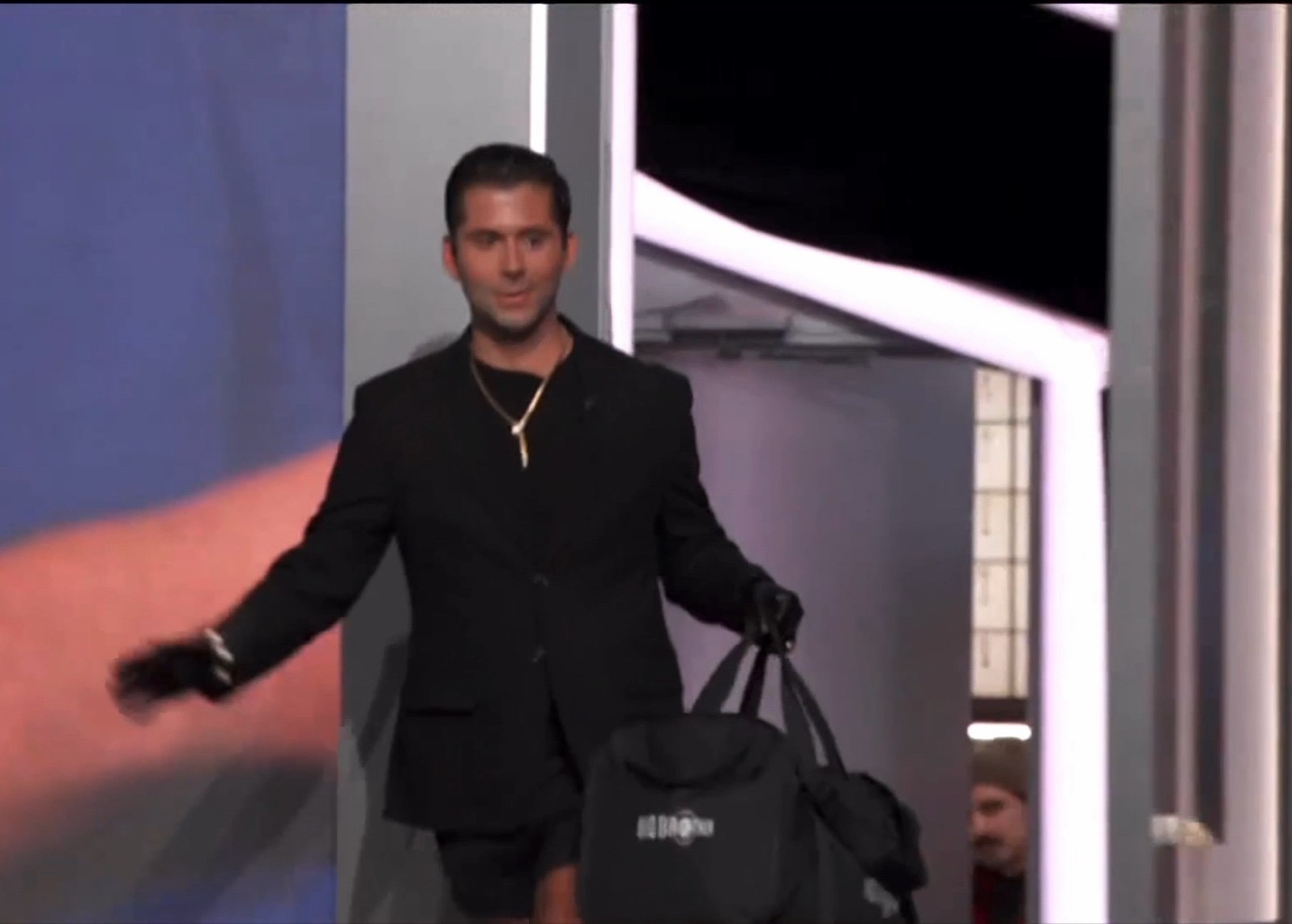 A beach at sunset with vibrant colors and calm waves.