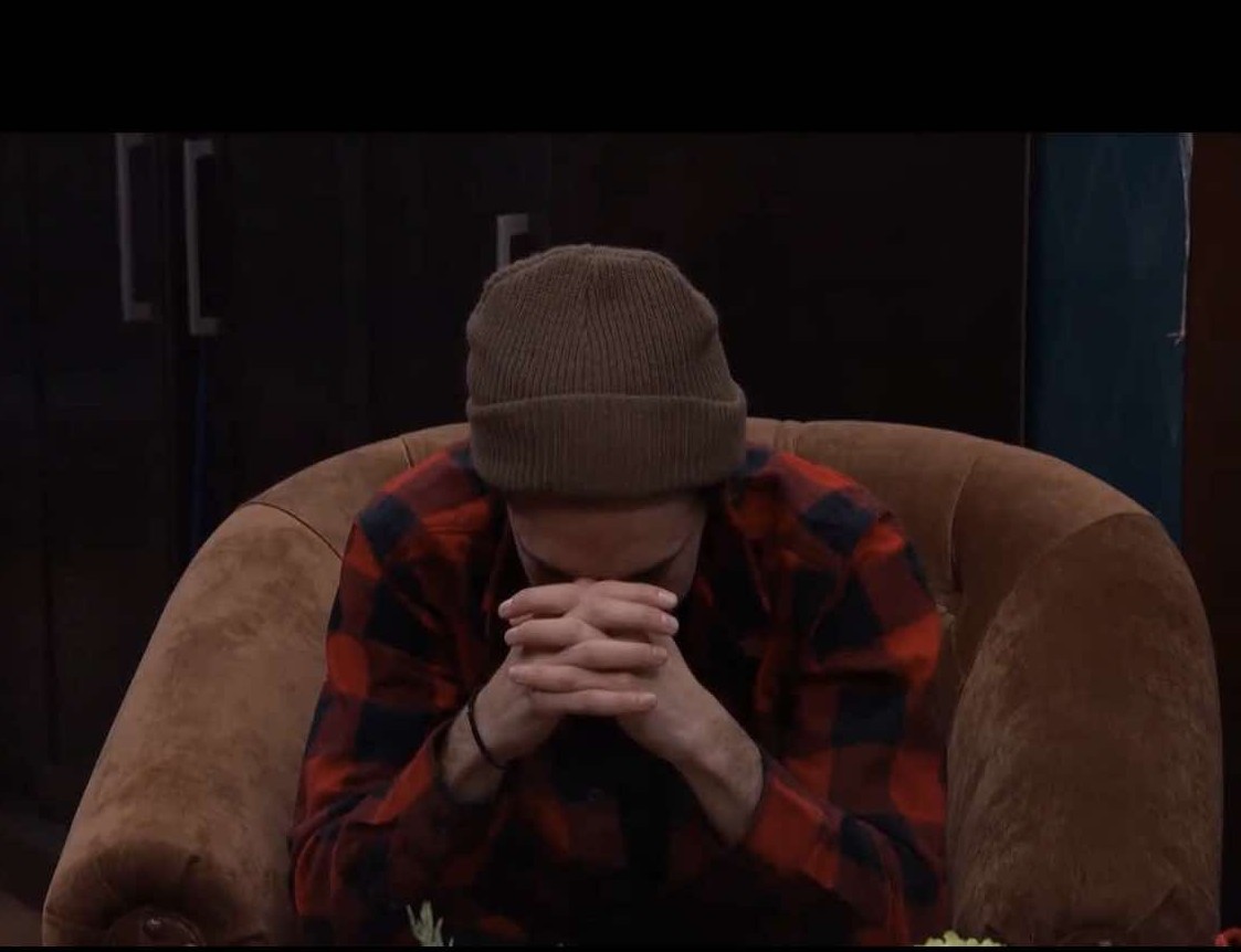 A beach at sunset with vibrant colors and calm waves.