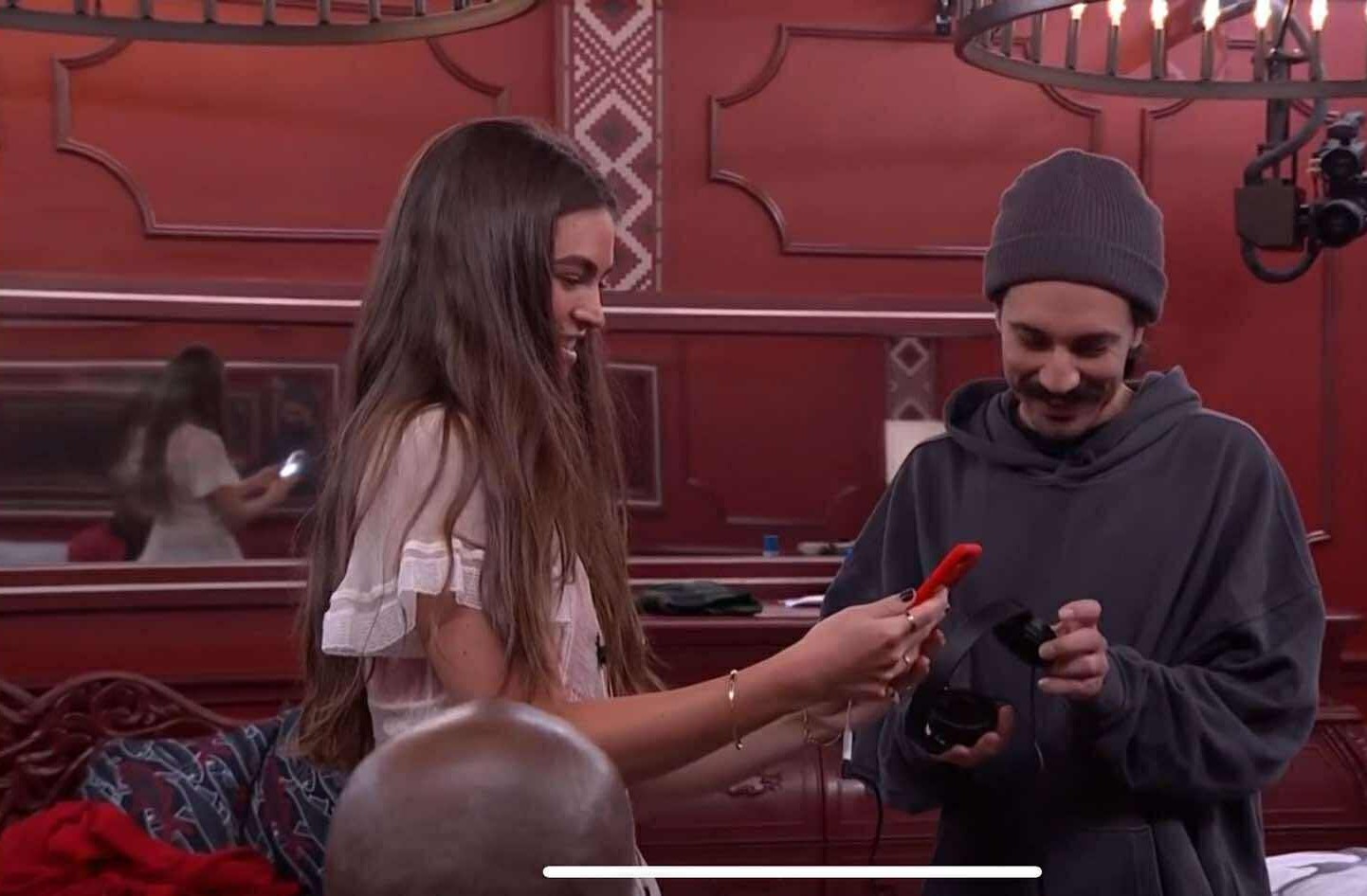 A beach at sunset with vibrant colors and calm waves.