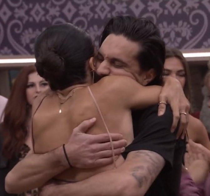 A beach at sunset with vibrant colors and calm waves.