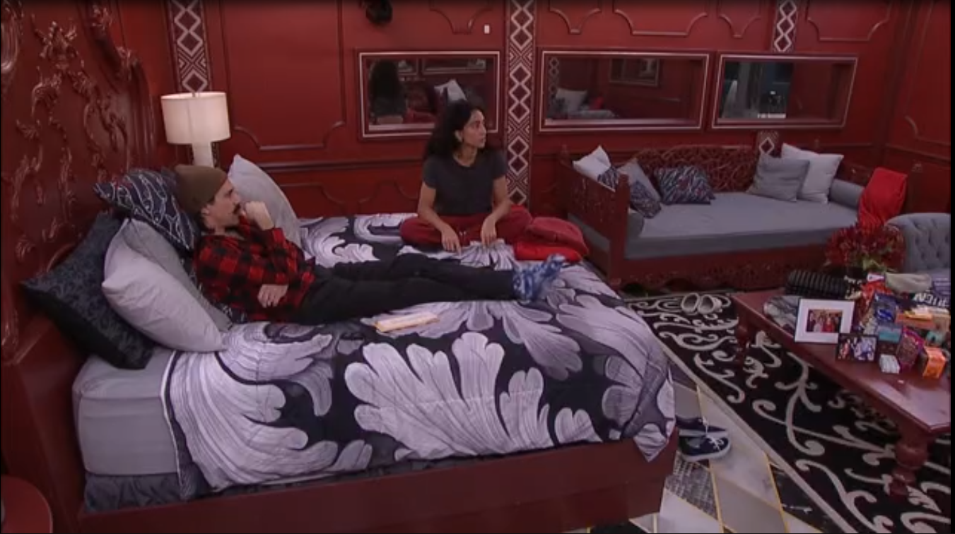 A beach at sunset with vibrant colors and calm waves.