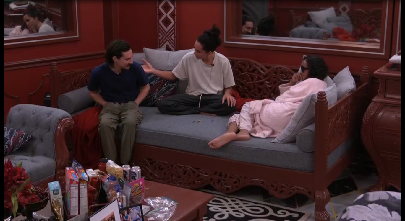 A beach at sunset with vibrant colors and calm waves.