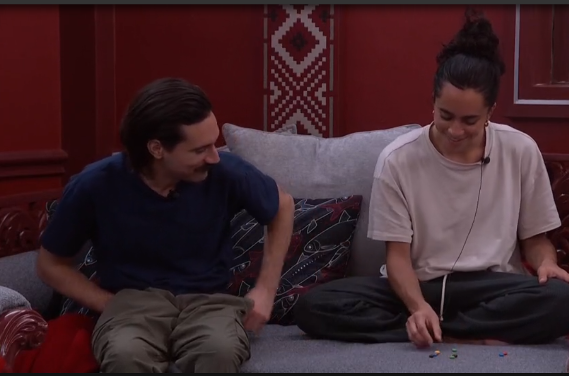 A beach at sunset with vibrant colors and calm waves.