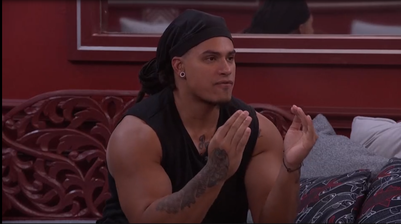 A beach at sunset with vibrant colors and calm waves.